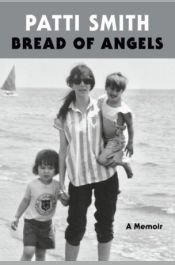 Cover of Bread of Angels: A Memoir by Patti Smith, a black-and-white photograph of a woman with two children on a beach